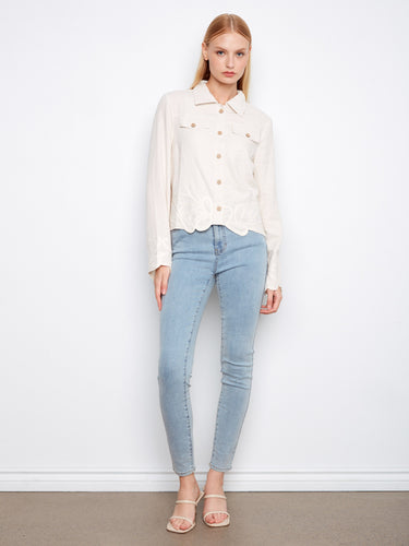 Elegant cream jacket showcasing faux flap pockets and intricate embroidery for added charm by Charlie B.