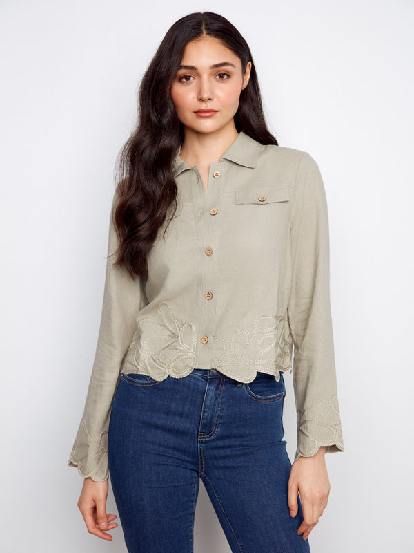 This jacket features a short length, perfect for pairing with high-waisted jeans or skirts. The design is both chic and versatile by Charlie B.