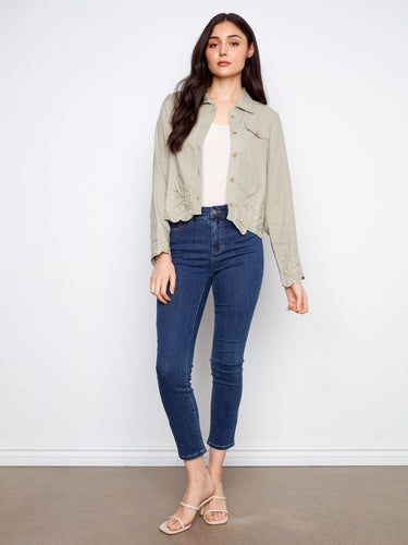 The embroidered hem and cuffs add a touch of elegance to this stylish jacket, making it a standout piece for any wardrobe by Charlie B.