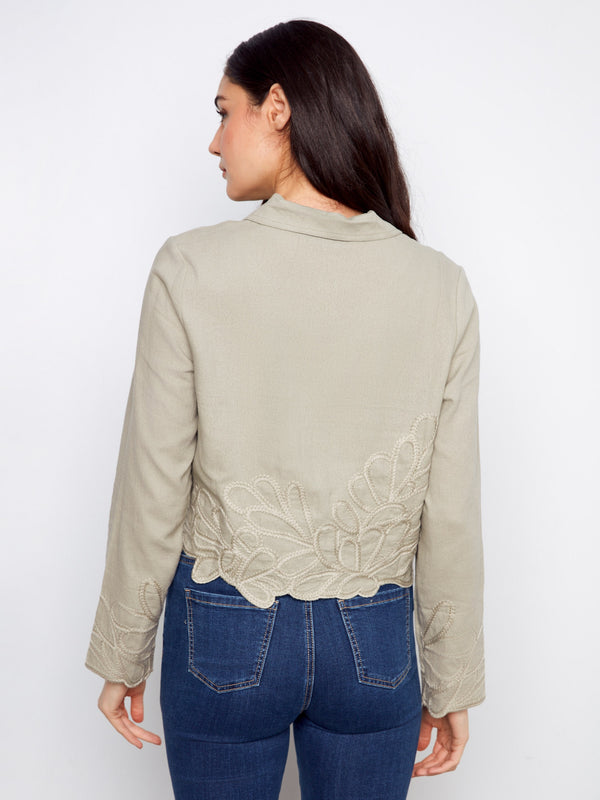 Faux flap pockets on this jacket provide an added style element without compromising its sleek silhouette by Charlie B.