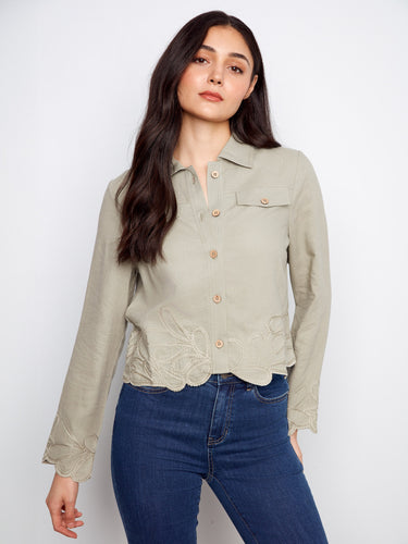 Designed with attention to detail, the jacket's flap pockets offer both style and convenience. By Charlie B.