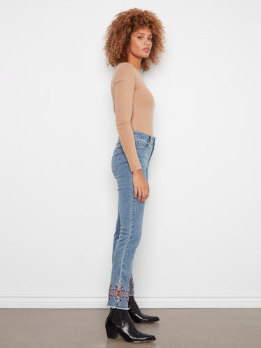 Five-pocket design medium blue jeans with exquisite embroidery on the hem, perfect for versatile styling by Charlie B.