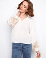 Linen blend blouse featuring intricate openwork lace on the sleeves, adding a touch of elegance by Charlie B.