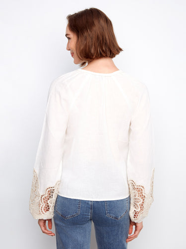 Stylish white blouse with exquisite balloon sleeves and detailed lace accents for added flair by Charlie B.
