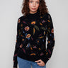 Sweater featuring a mock neck with beautiful floral embroidery, perfect for adding elegance to any outfit by Charlie B.