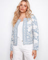 Light blue jacket with floral embroidery, showcasing a short length and elegant design by Charlie B.