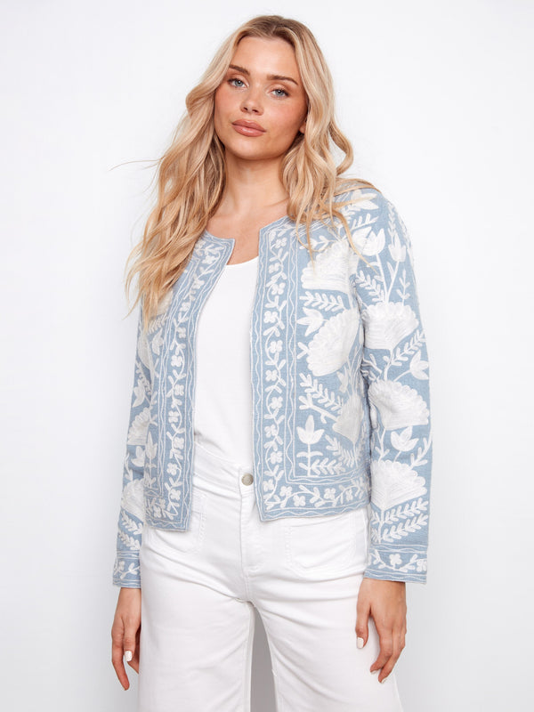 Light blue jacket with floral embroidery, showcasing a short length and elegant design by Charlie B.