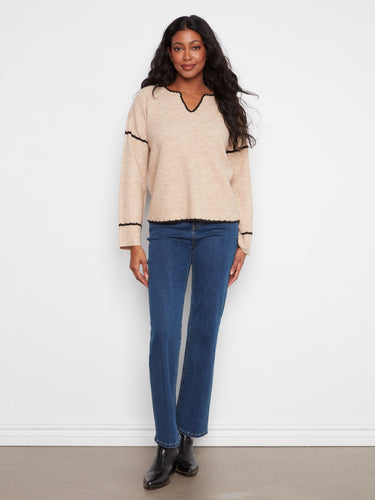 This sweater features drop shoulders and long wide sleeves for a relaxed fit. By Charlie B.