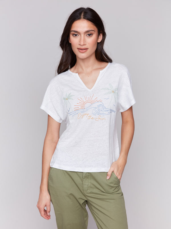 White linen blend top with relaxed dolman sleeves, highlighted by ocean-inspired embroidery by Charlie B.