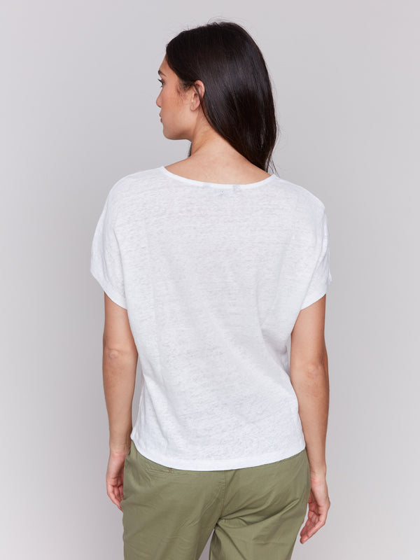 Linen blend top with a stylish split neckline and oceanic embroidery accents by Charlie B.