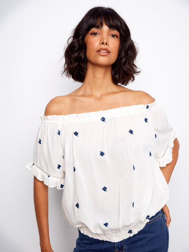 Chic off-the-shoulder blouse with delicate embroidered flowers and a comfortable elastic hem by Charlie B.