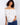 Stylish white blouse featuring short flutter sleeves and intricate blue embroidery for a casual look by Charlie B.