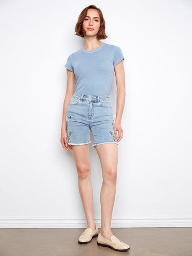 Light blue denim shorts designed with a comfortable five-pocket layout and delicate side details by Charlie B.