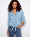 Blouse with collared V-neckline and floral embroidery, featuring a front tie and chest pocket by Charlie B.