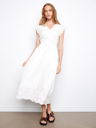 Elegant white dress with ruffle cap sleeves and embroidered border by Charlie B.
