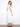 Stylish white dress showcasing ruffle cap sleeves and hidden pockets by Charlie B.