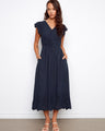 Elegant dress with a flattering empire elastic waist, perfect for any occasion. Designed by Charlie B.