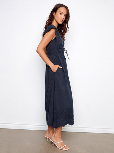 Charming dress featuring ruffle cap sleeves for a touch of romance and style. Designed by Charlie B.