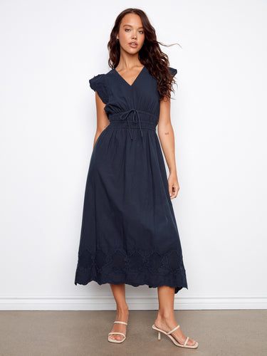 Stylish midi length dress with hidden pockets, combining fashion and functionality effortlessly. By Charlie B.
