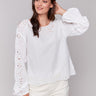 White blouse with balloon long sleeves and intricate details by Charlie B.