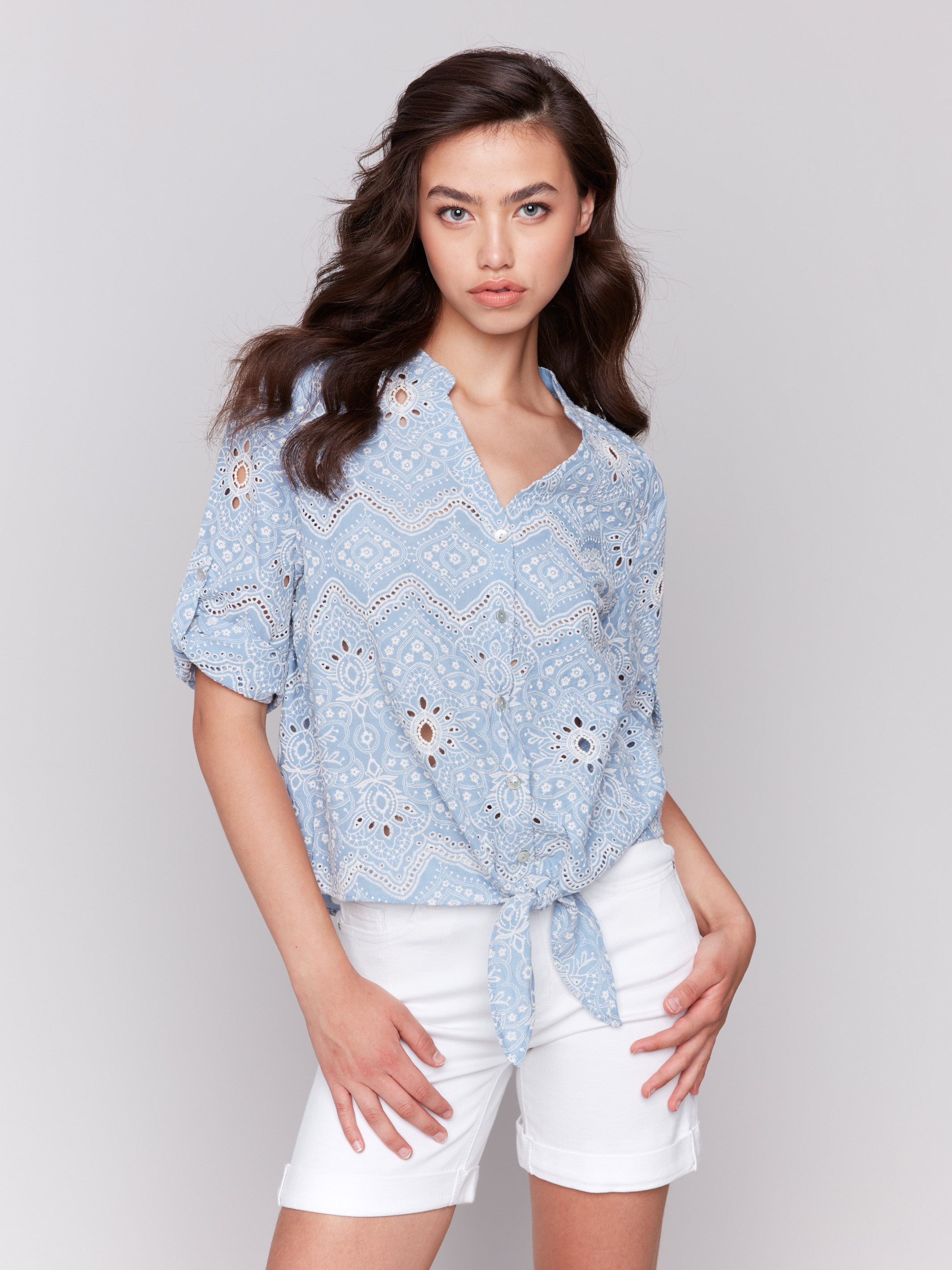 Blue cotton blouse with V-neck and eyelet details by Charlie B.
