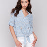 Blue cotton blouse with V-neck and eyelet details by Charlie B.
