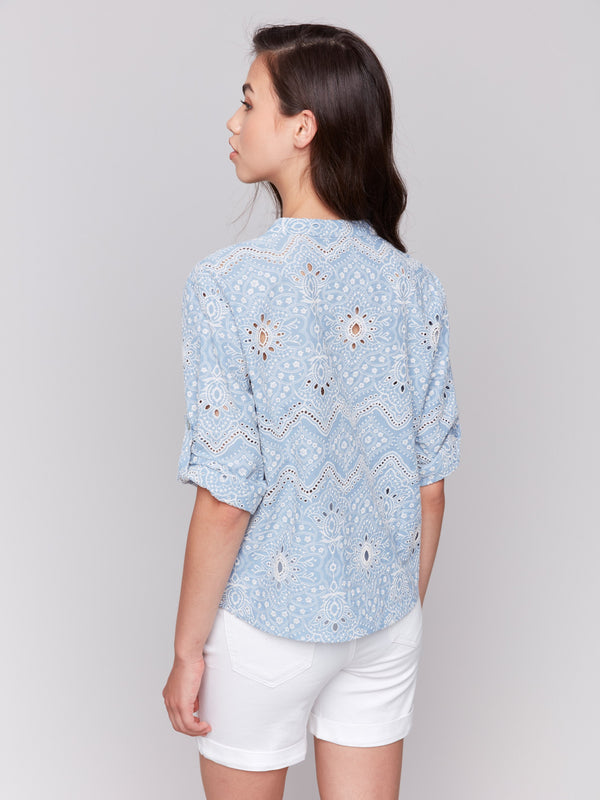 3/4 short sleeves with button tab on a blue cotton blouse by Charlie B.