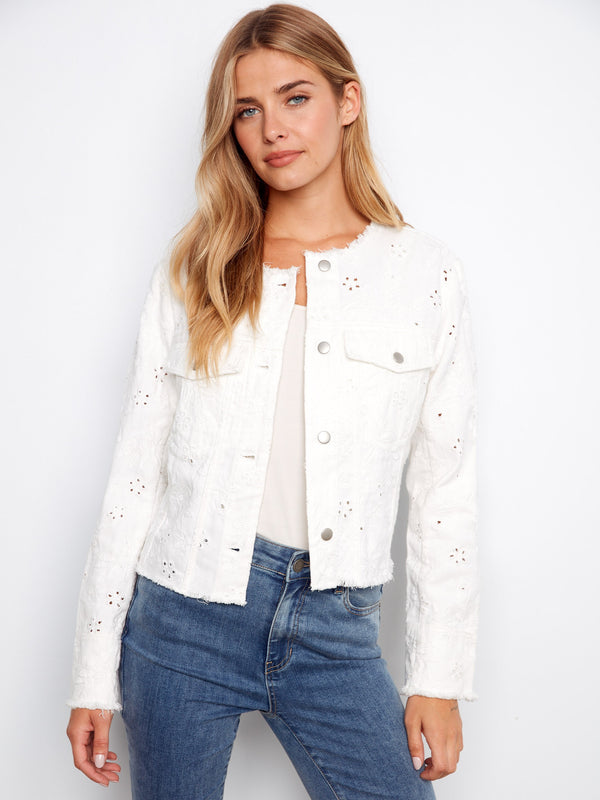 White denim jacket featuring frayed hem and eyelet details, complete with button closure and chest flap pockets by Charlie B.