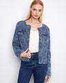 Medium blue denim jacket with eyelet details and frayed hem, featuring a stylish button front closure by Charlie B.