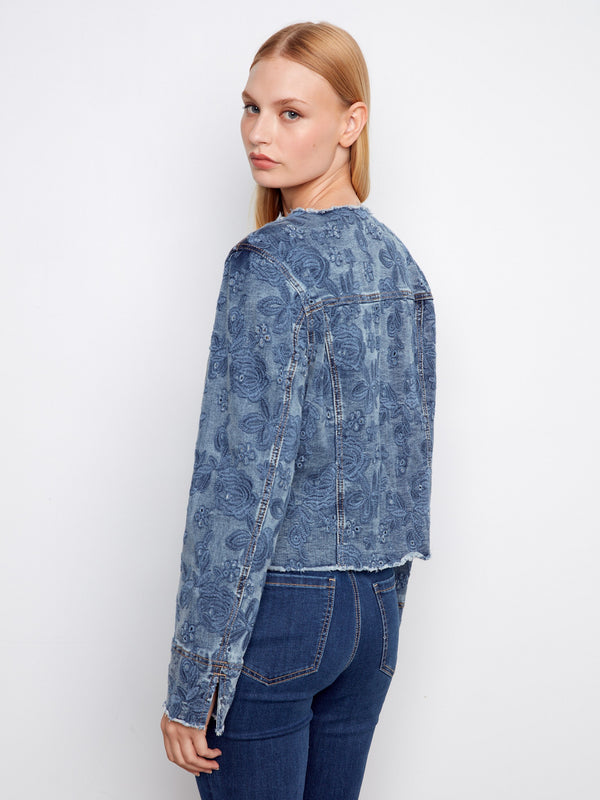 Medium blue stretch denim jacket highlighting a trendy frayed hem and intricate eyelet details by Charlie B.