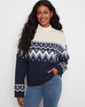 Sweater featuring a mock neckline and intricate Fair Isle jacquard pattern, perfect for cozy days. Designed by Charlie B.