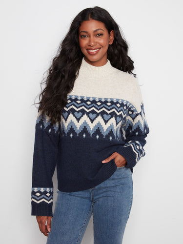 Sweater featuring a mock neckline and intricate Fair Isle jacquard pattern, perfect for cozy days. Designed by Charlie B.