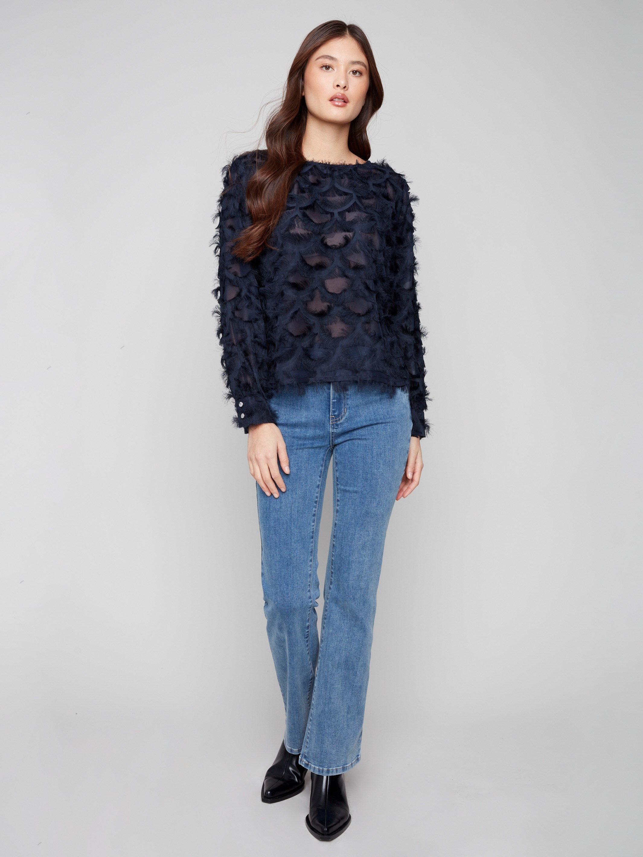 Chiffon blouse in navy featuring a decorative pattern throughout, adding a touch of elegance by Charlie B.