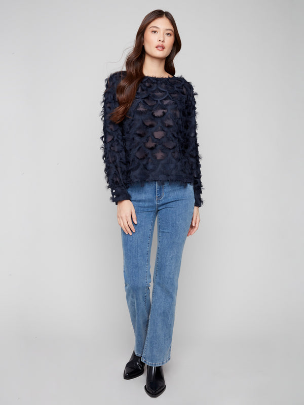 Chiffon blouse in navy featuring a decorative pattern throughout, adding a touch of elegance by Charlie B.