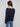 Sophisticated navy blouse with button cuffs and long sleeves, ideal for chic styling by Charlie B.