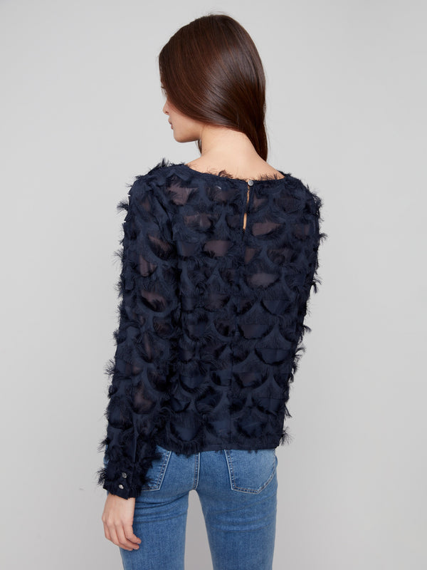 Sophisticated navy blouse with button cuffs and long sleeves, ideal for chic styling by Charlie B.
