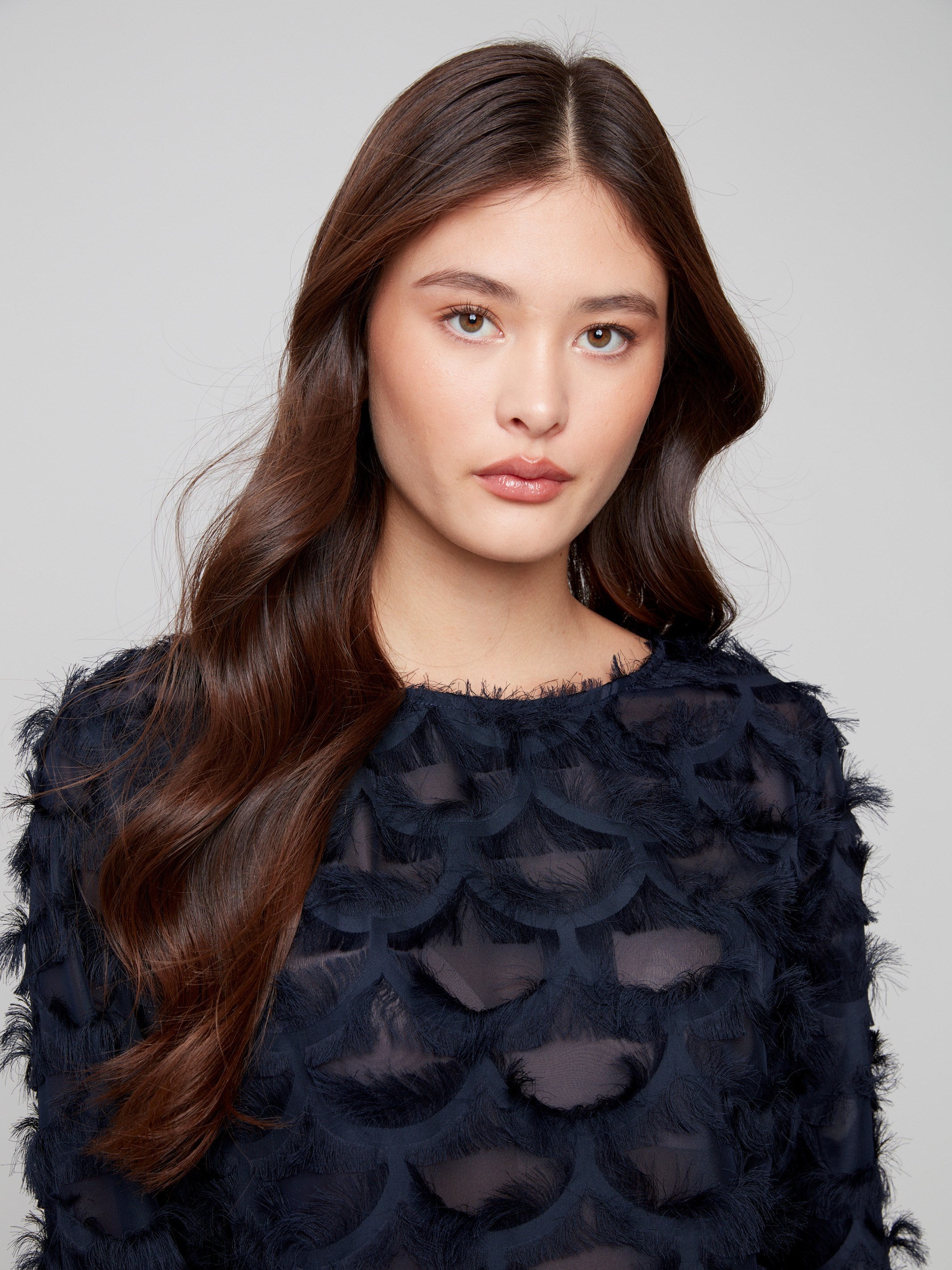 Elegant chiffon blouse in navy with button closure at back and intricate detailing by Charlie B.