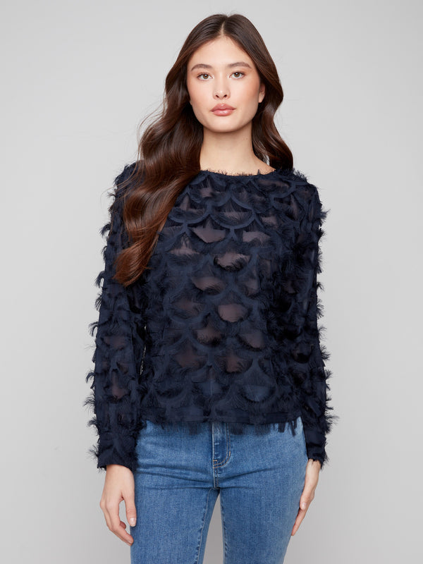 Sophisticated chiffon blouse in navy featuring intricate patterns and stylish button closure at the back by Charlie B.