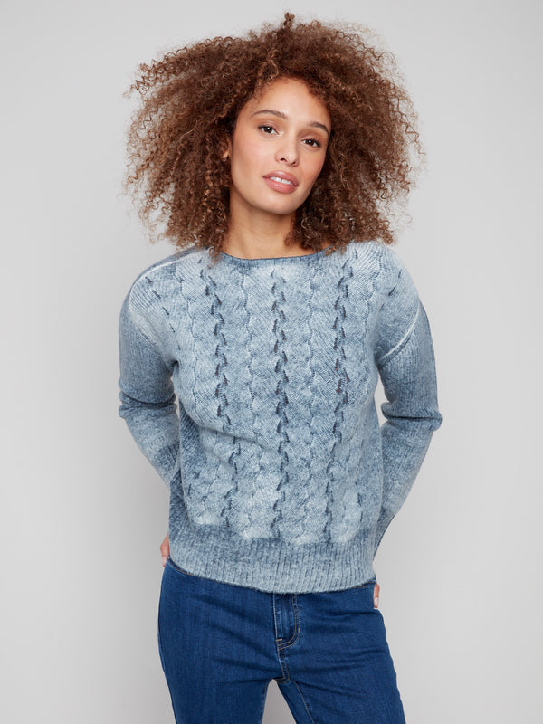 Stylish blue sweater with ribbed cuffs and hem, designed for comfort and elegance by Charlie B.
