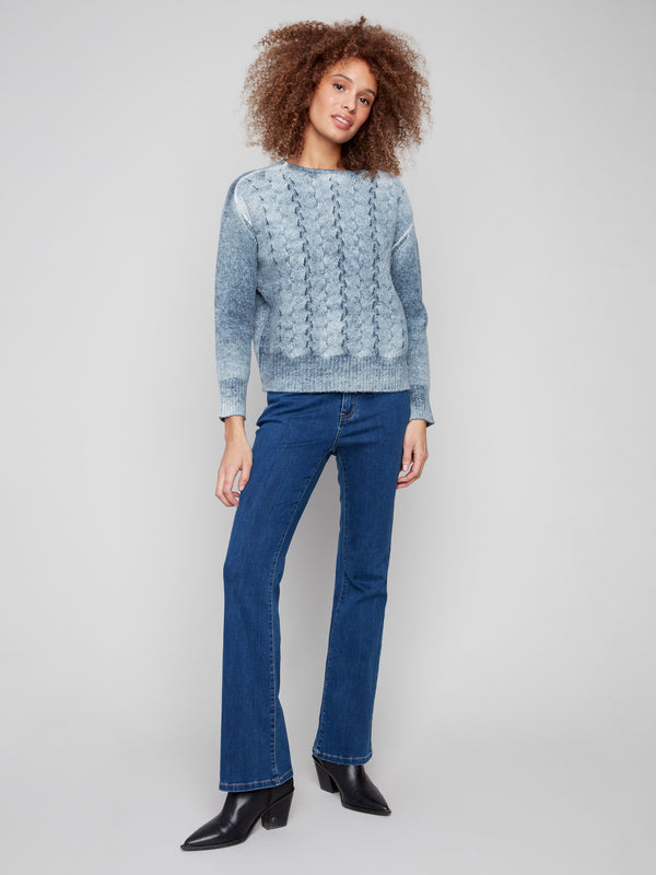 Elegant crew neck sweater in blue with intricate cable knit detailing, ideal for any occasion by Charlie B.