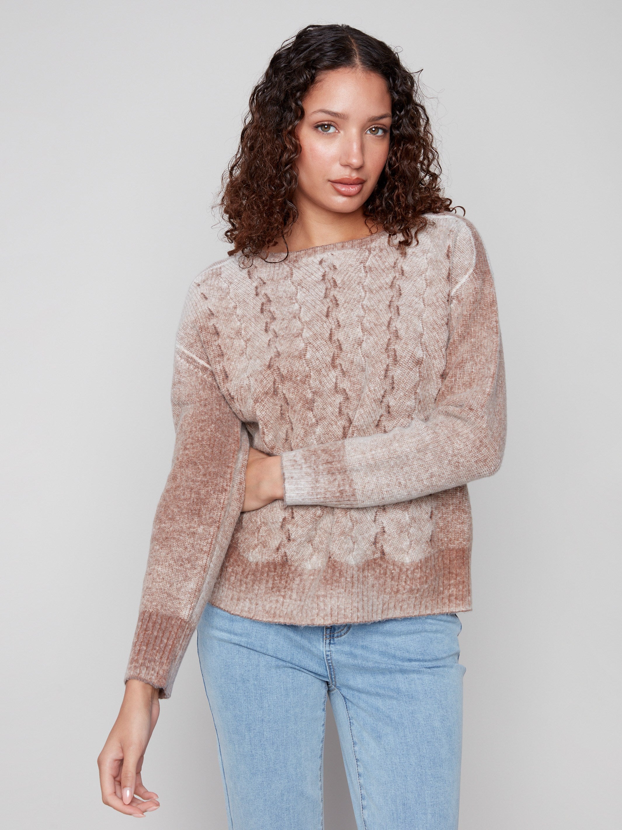 Elegant sepia knitwear showcasing drop shoulders, offering a modern silhouette by Charlie B.