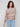 Elegant sepia knitwear showcasing drop shoulders, offering a modern silhouette by Charlie B.