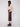 Cabernet faux leather midi skirt showcasing lined fabric, complemented by a beige top and brown ankle boots by Charlie B.