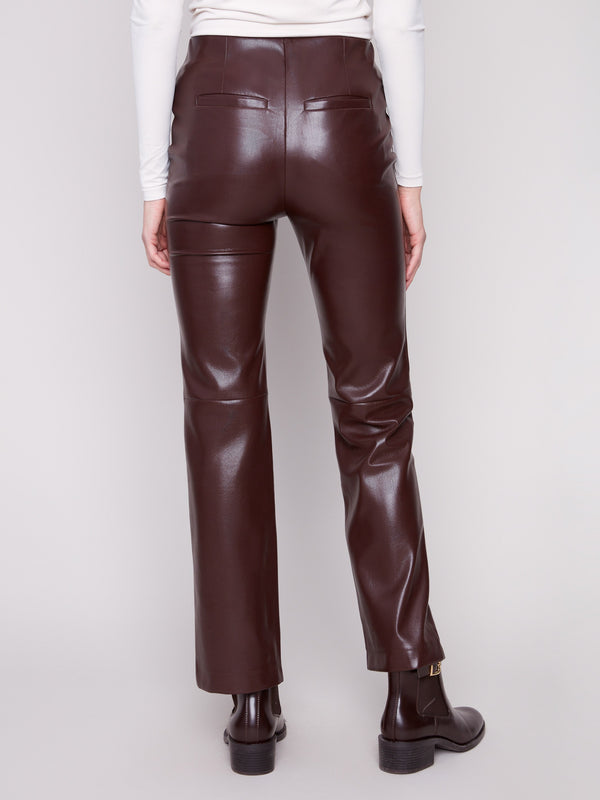 Stylish cabernet faux leather pants designed with seamless back welt pockets for added flair by Charlie B.