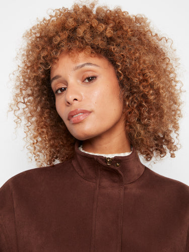 Refined brown jacket highlighting the stand collar, adding elegance to any outfit. By Charlie B.