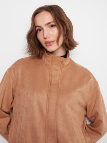 Stylish faux suede bomber in latte shade with welt pockets, perfect for keeping essentials secure by Charlie B.