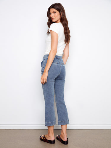 Cropped denim pants featuring elegant bow-detailed patch pockets, perfect for adding flair to any outfit. By Charlie B.