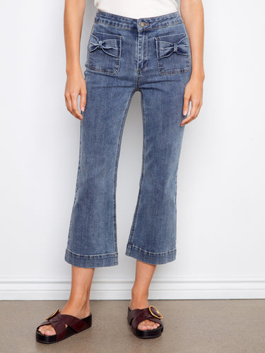 Flared fit jeans in stretch twill fabric, offering both style and comfort with their regular rise design. By Charlie B.