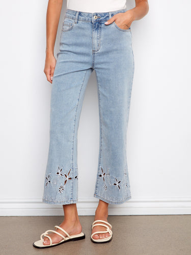 Flared leg design with palm tree embroidery adds flair to these comfortable stretch denim jeans. Made by Charlie B.