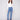 Blue jeans featuring a stylish flare leg with colorful floral embroidery, crafted in stretch denim for comfort by Charlie B.